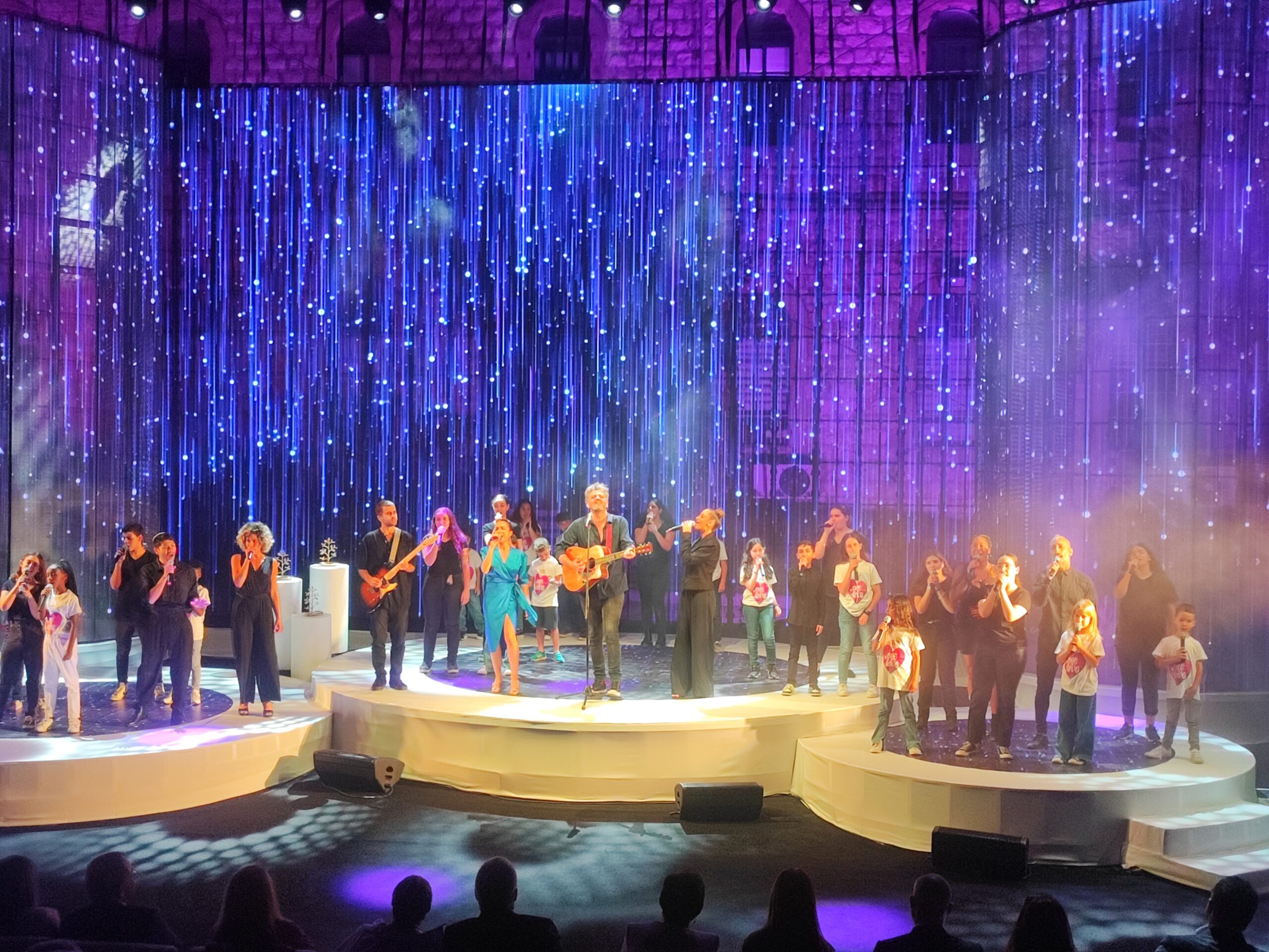 Musicians and children performing at a Rambam gala celebration