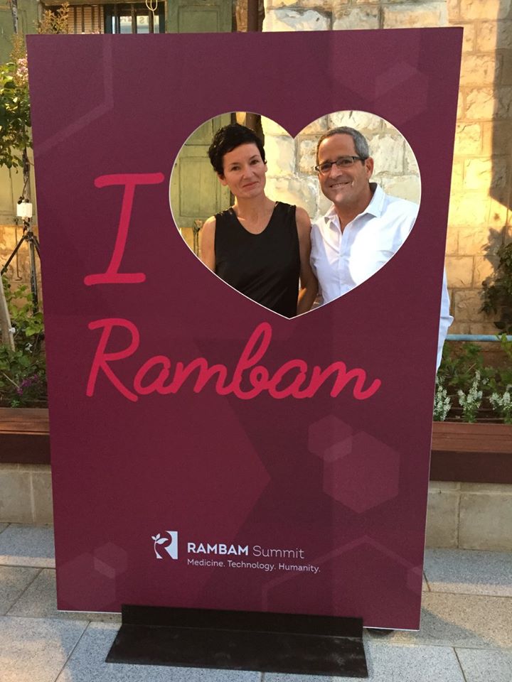 A couple posing in an I-love-Rambam frame at the Rambam Summit