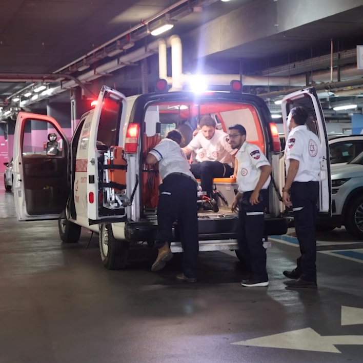 Magen David Adom paramedics unloading an ambulance in the underground hospital