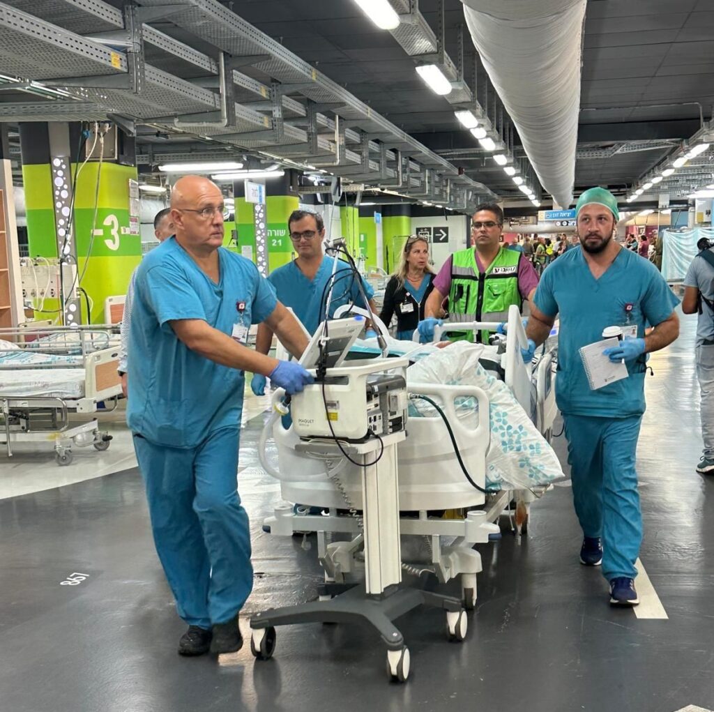 Medical team moving a patient through Rambam's underground hospital